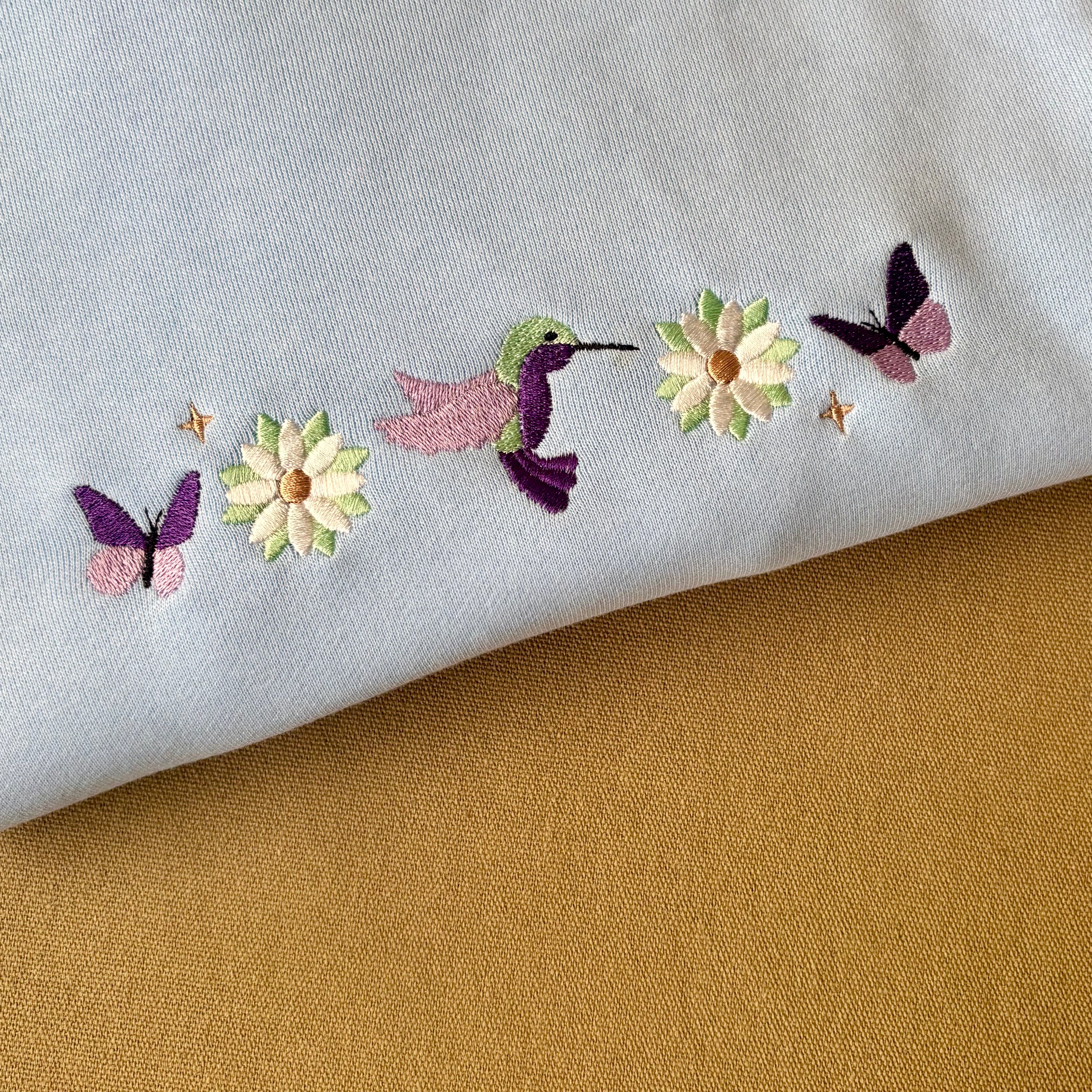 Buzo primavera bordado