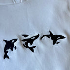 Canguro con orcas bordadas