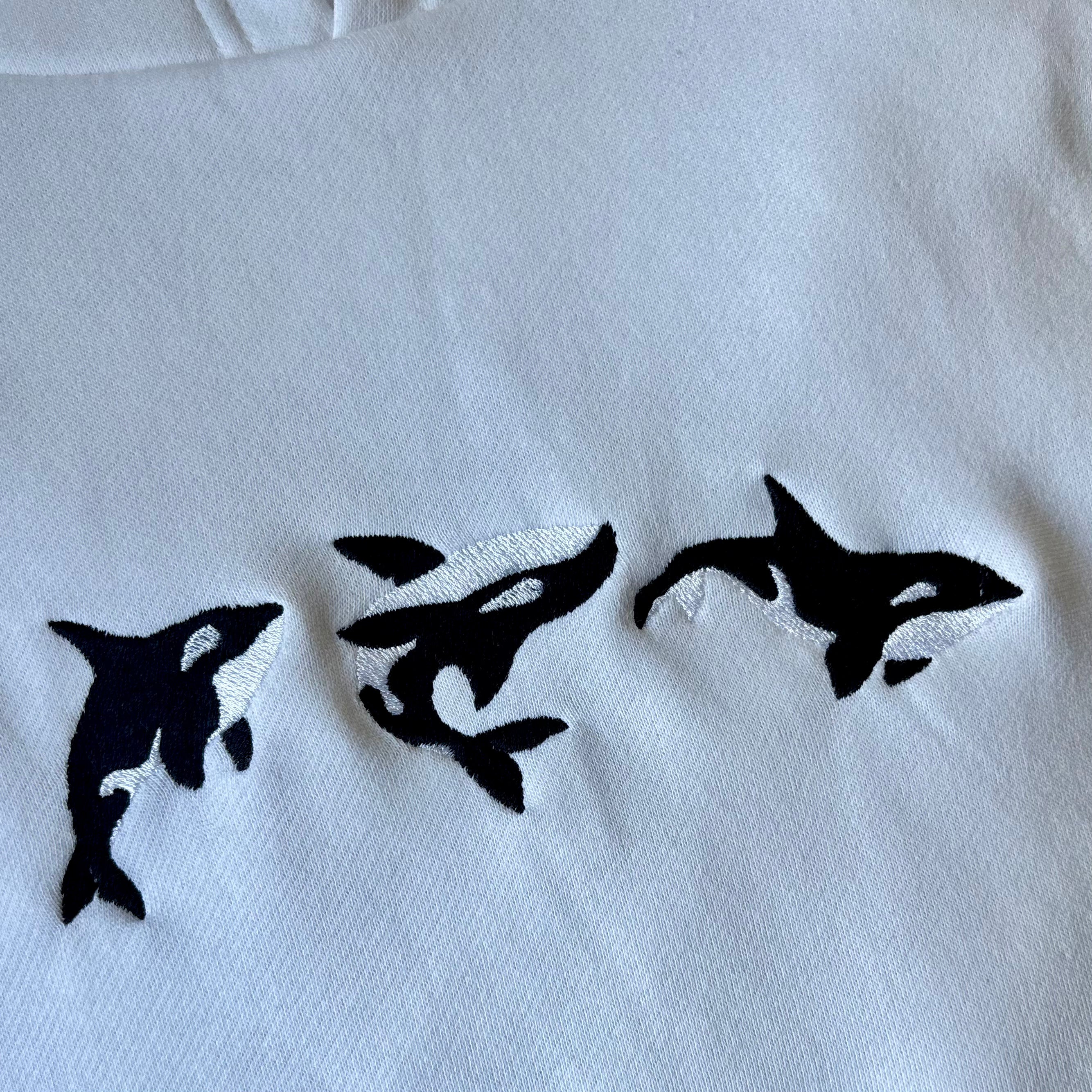 Canguro con orcas bordadas