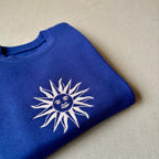 Buzo infantil con sol uruguayo bordado