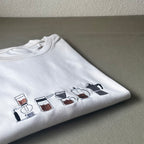 Remera con cafeteras bordadas