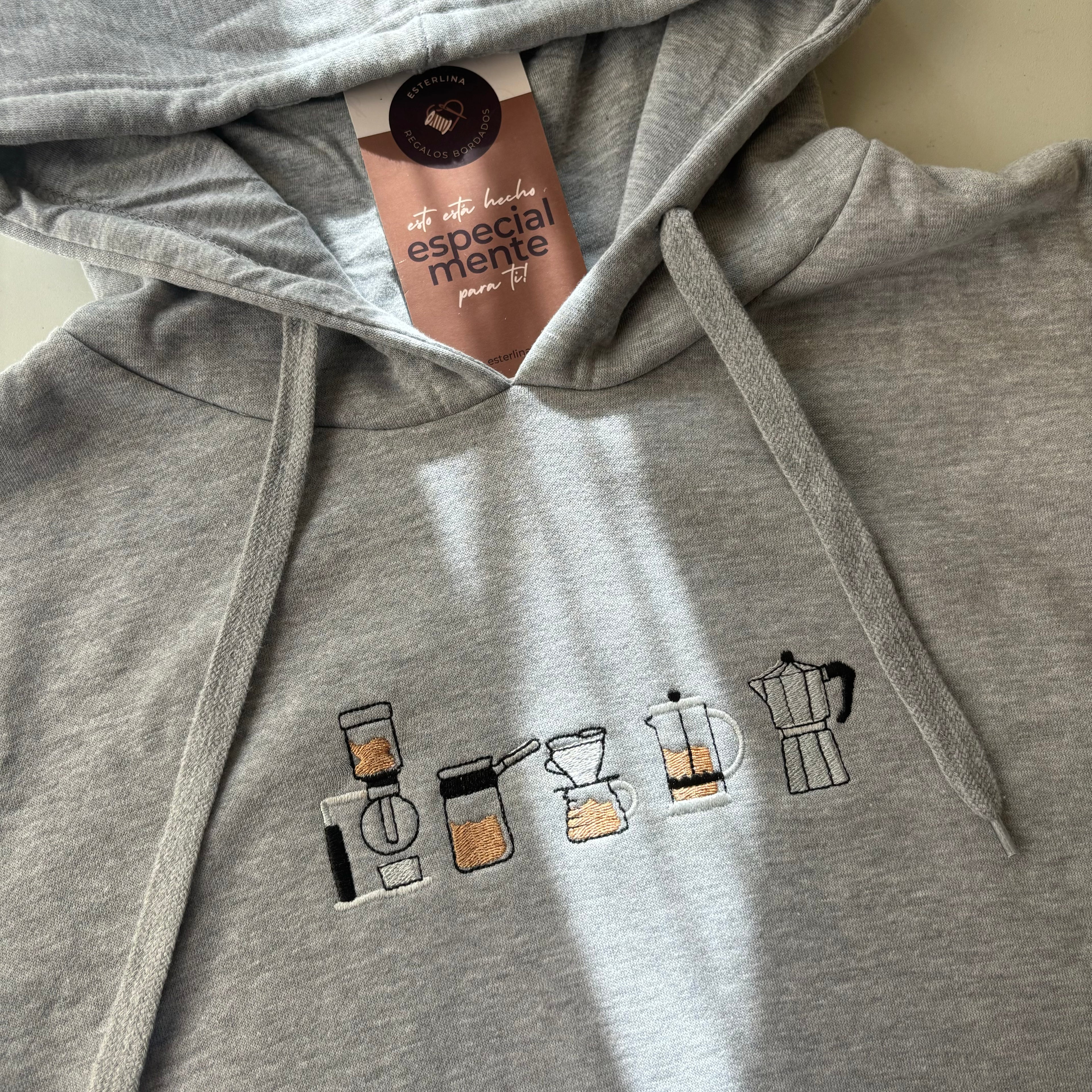 Canguro con cafeteras bordadas