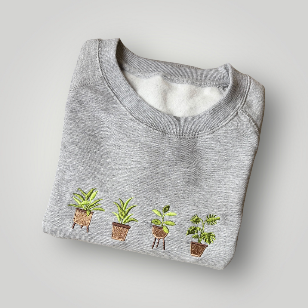 Buzo con plantas bordadas