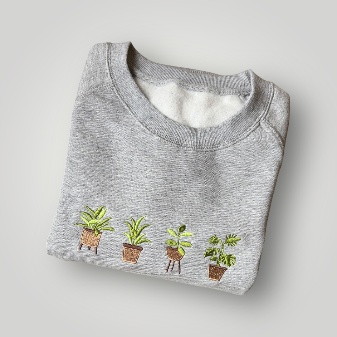 Buzo con plantas bordadas