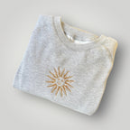 Buzo con sol uruguayo bordado