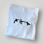 Canguro con orcas bordadas