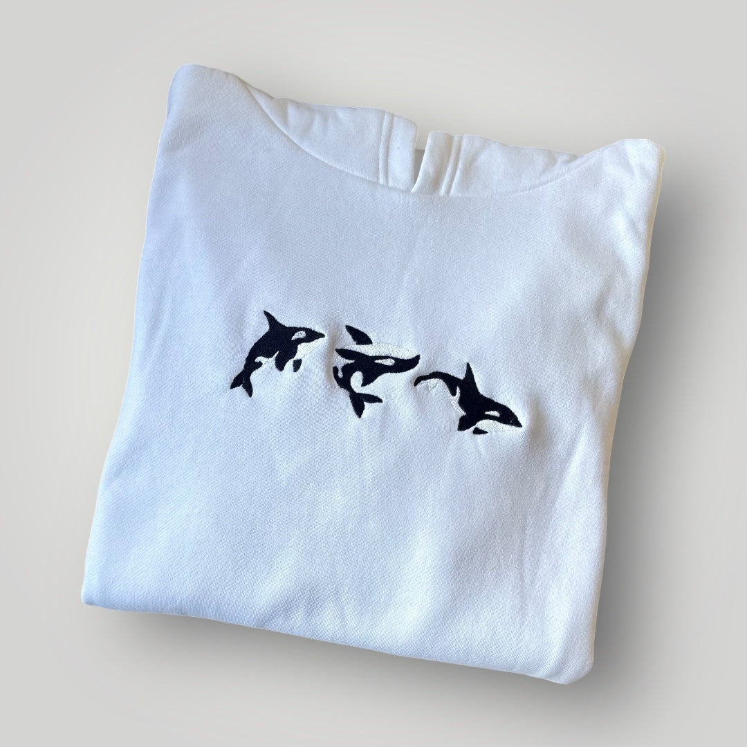 Canguro con orcas bordadas