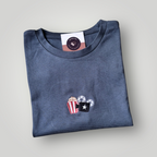 Remera bordada cine y pop