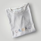 Remera bordada con símbolos uruguayos