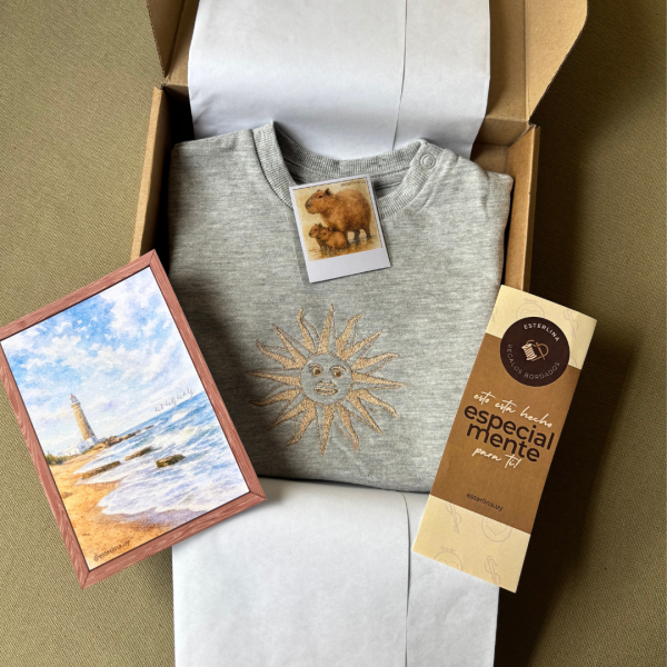 Buzo de bebé con sol uruguayo bordado